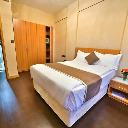 Speke Apartments Wampewo Kampala Bagian luar foto